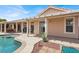 Spacious backyard featuring a covered patio and large swimming pool at 8608 Willow Cabin St, Las Vegas, NV 89131
