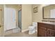 Bathroom featuring tile floors, a shower with a glass door, and vanity with a dark wood cabinet at 8608 Willow Cabin St, Las Vegas, NV 89131