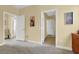 Bedroom featuring multiple entry doors, carpeted floors, and beige walls at 8608 Willow Cabin St, Las Vegas, NV 89131