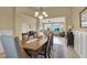 Elegant dining room with chandelier and views into the living room, perfect for entertaining at 8608 Willow Cabin St, Las Vegas, NV 89131
