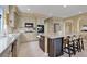 Spacious kitchen with island, stainless steel appliances, and ample counter space at 8608 Willow Cabin St, Las Vegas, NV 89131