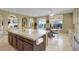 Bright kitchen featuring an island with seating, stainless appliances, and backyard access at 8608 Willow Cabin St, Las Vegas, NV 89131