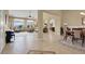 Spacious living and dining areas featuring tile floors, neutral walls, and large windows at 8608 Willow Cabin St, Las Vegas, NV 89131
