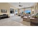Comfortable living room featuring a fireplace, media center, and ample seating at 8608 Willow Cabin St, Las Vegas, NV 89131