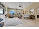 Bright and airy living room with fireplace, custom built-ins, and backyard views at 8608 Willow Cabin St, Las Vegas, NV 89131