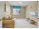 Bright and airy living room with couch and play area at 8608 Willow Cabin St, Las Vegas, NV 89131