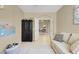 Comfortable living room featuring couch, storage and adjacent dining at 8608 Willow Cabin St, Las Vegas, NV 89131