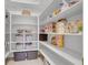 Organized pantry with ample shelving, providing plenty of storage space for food items at 8608 Willow Cabin St, Las Vegas, NV 89131
