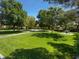 Lush green park with mature trees, walking paths, and picnic tables, perfect for outdoor enjoyment at 8608 Willow Cabin St, Las Vegas, NV 89131