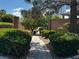 Charming walkway surrounded by lush greenery and mature trees in a peaceful setting at 8608 Willow Cabin St, Las Vegas, NV 89131