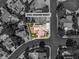 Birds eye view of a property highlighting lush landscaping, and neighborhood streets at 8761 Anchor Point Ave, Las Vegas, NV 89117