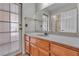 Bathroom features a vanity, door to outside, and a view into the shower at 8761 Anchor Point Ave, Las Vegas, NV 89117