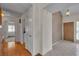 Interior entryway features tile and wood floors with view to the front door and hallways at 8761 Anchor Point Ave, Las Vegas, NV 89117