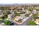 Expansive neighborhood with well-maintained homes, mature trees, and manicured lawns against a backdrop of distant mountains at 8761 Anchor Point Ave, Las Vegas, NV 89117