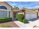 Charming home featuring a well-manicured lawn and a convenient two-car garage at 8761 Anchor Point Ave, Las Vegas, NV 89117
