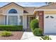 Inviting home exterior with a well-kept lawn and traditional design elements at 8761 Anchor Point Ave, Las Vegas, NV 89117