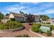 Well-maintained front yard with lush landscaping and a charming exterior at 8761 Anchor Point Ave, Las Vegas, NV 89117
