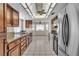 Bright kitchen with granite counters and stainless steel refrigerator at 8761 Anchor Point Ave, Las Vegas, NV 89117