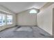 Spacious living room with a large window, vaulted ceiling, and lots of natural light at 8761 Anchor Point Ave, Las Vegas, NV 89117