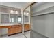 Bathroom boasts dual sinks, ample counter space, large mirror, and closet with mirrored doors at 8761 Anchor Point Ave, Las Vegas, NV 89117