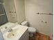 Bathroom in a single Gathering home with white toilet and sink next to a shower at 8813 Pavia Dr, Las Vegas, NV 89117