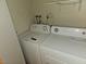 Laundry room with white washing machine and clothes dryer in a single Gathering home at 8813 Pavia Dr, Las Vegas, NV 89117