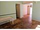 A living room with green walls and tiled floors in a single Gathering home at 8813 Pavia Dr, Las Vegas, NV 89117
