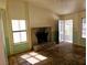 A living room with fireplace, windows, and tiled floors in a single Gathering home at 8813 Pavia Dr, Las Vegas, NV 89117