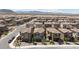 A beautiful neighborhood showcases well-maintained houses with lovely landscaping against a mountain backdrop at 8873 Howell St, Las Vegas, NV 89166