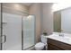 Well-lit bathroom showcases a glass-enclosed shower, toilet, and vanity sink at 8873 Howell St, Las Vegas, NV 89166