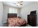 Cozy bedroom with a comfortable bed, dresser, and neutral color scheme at 8873 Howell St, Las Vegas, NV 89166