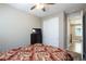 Cozy bedroom features a ceiling fan, closet, and dresser with a TV at 8873 Howell St, Las Vegas, NV 89166
