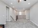 Bright bonus room featuring neutral walls, carpet, stairway and railing to the floor below at 8873 Howell St, Las Vegas, NV 89166