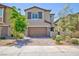 Charming two-story home with a two-car garage, desert landscaping, and neutral color scheme at 8873 Howell St, Las Vegas, NV 89166