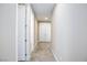 Clean hallway with carpet, neutral walls, doors to other rooms and storage at 8873 Howell St, Las Vegas, NV 89166