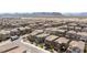 Expansive aerial view of a well-planned community with uniform homes, streets, and desert landscaping at 8873 Howell St, Las Vegas, NV 89166