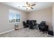 Bright office with desk, black rolling chairs and a window for plenty of natural light at 8873 Howell St, Las Vegas, NV 89166