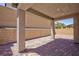 Covered patio showcasing brick flooring and brick privacy wall at 8873 Howell St, Las Vegas, NV 89166