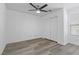 Bedroom with modern ceiling fan, window, closet and wood-look vinyl flooring at 9174 Mcginnis Ave, Las Vegas, NV 89148