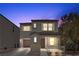 Charming two-story home featuring a covered porch and a well-maintained front yard at 9174 Mcginnis Ave, Las Vegas, NV 89148