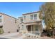 Charming two-story home featuring a covered porch and a well-maintained front yard at 9174 Mcginnis Ave, Las Vegas, NV 89148
