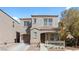 Charming two-story home featuring a covered porch and a well-maintained front yard at 9174 Mcginnis Ave, Las Vegas, NV 89148