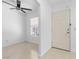 Bright foyer featuring neutral tile flooring, a ceiling fan, and a window for natural light at 9174 Mcginnis Ave, Las Vegas, NV 89148
