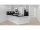 Bright kitchen features white cabinetry, dark countertops, and stainless steel appliances at 9174 Mcginnis Ave, Las Vegas, NV 89148