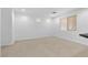 Bright living room with tile flooring and large windows offering natural light at 9174 Mcginnis Ave, Las Vegas, NV 89148