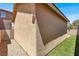 Spacious backyard with artificial grass, stucco walls, and a gravel area at 992 Wagner Valley St, Henderson, NV 89052
