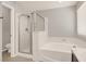 Bright bathroom featuring a glass shower and soaking tub at 992 Wagner Valley St, Henderson, NV 89052