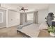 Cozy bedroom with neutral tones, a ceiling fan, built in closet and a comfortable bed at 992 Wagner Valley St, Henderson, NV 89052