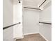Walk-in closet with custom shelving and ample storage space at 992 Wagner Valley St, Henderson, NV 89052