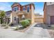 Inviting two-story home featuring a convenient driveway leading to a detached garage at 992 Wagner Valley St, Henderson, NV 89052